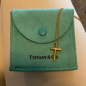 Gold Tiffany cross with single diamond